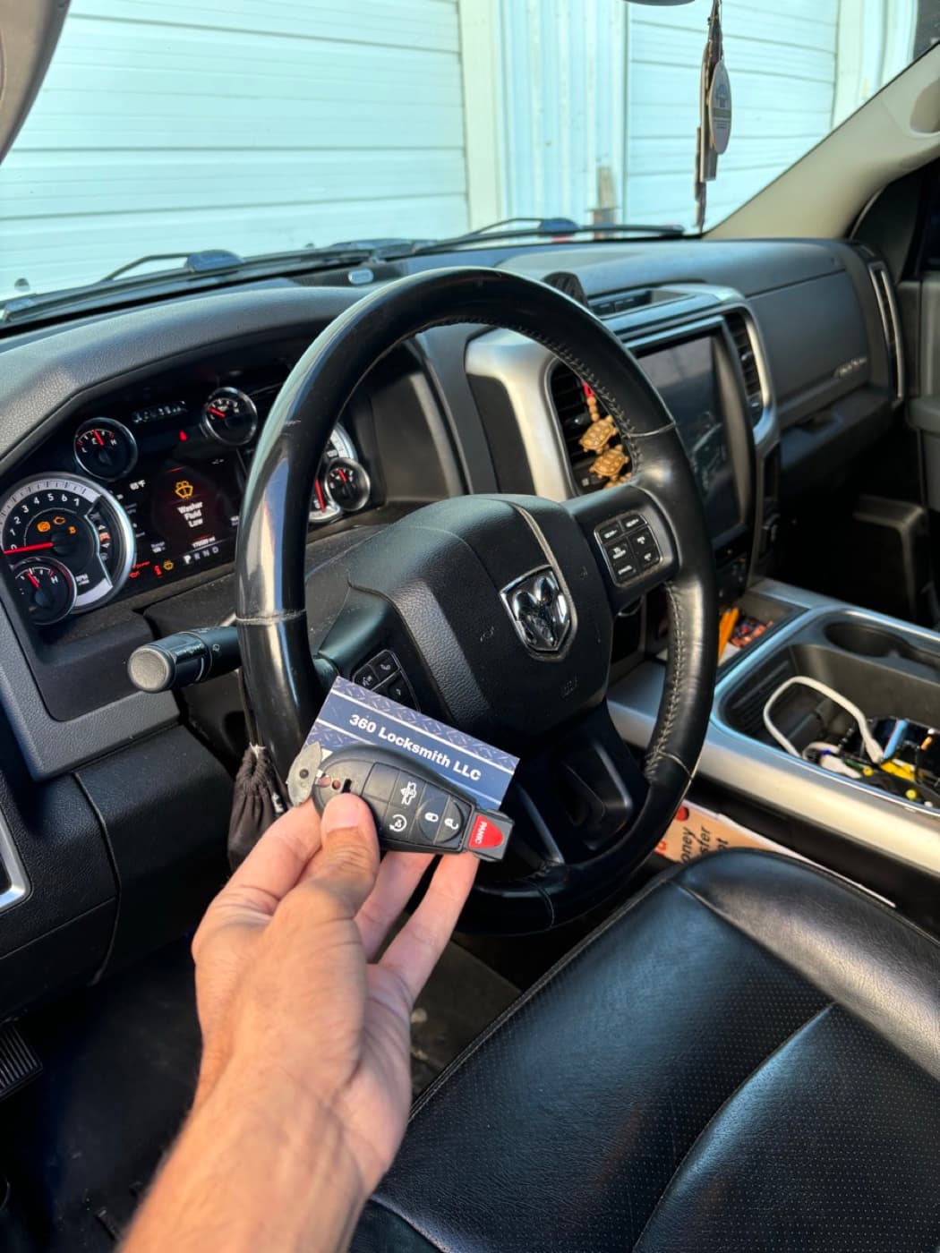 Dodge key fob overhead view with 360 Locksmith LLC business card