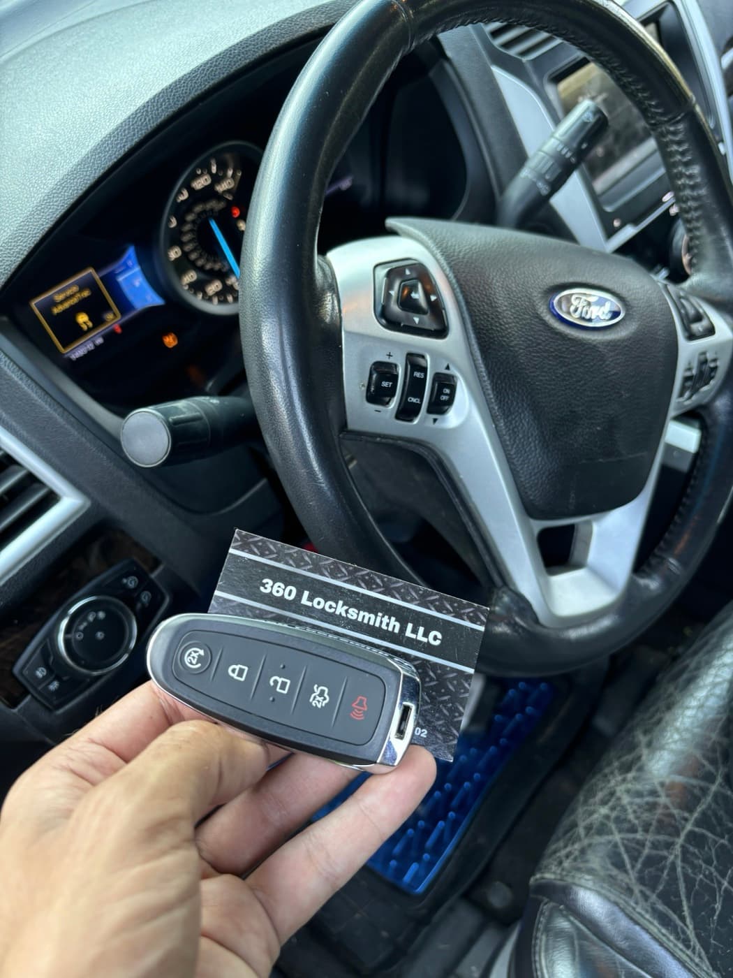 360 Locksmith LLC technician holding a completed Ford smart key fob replacement